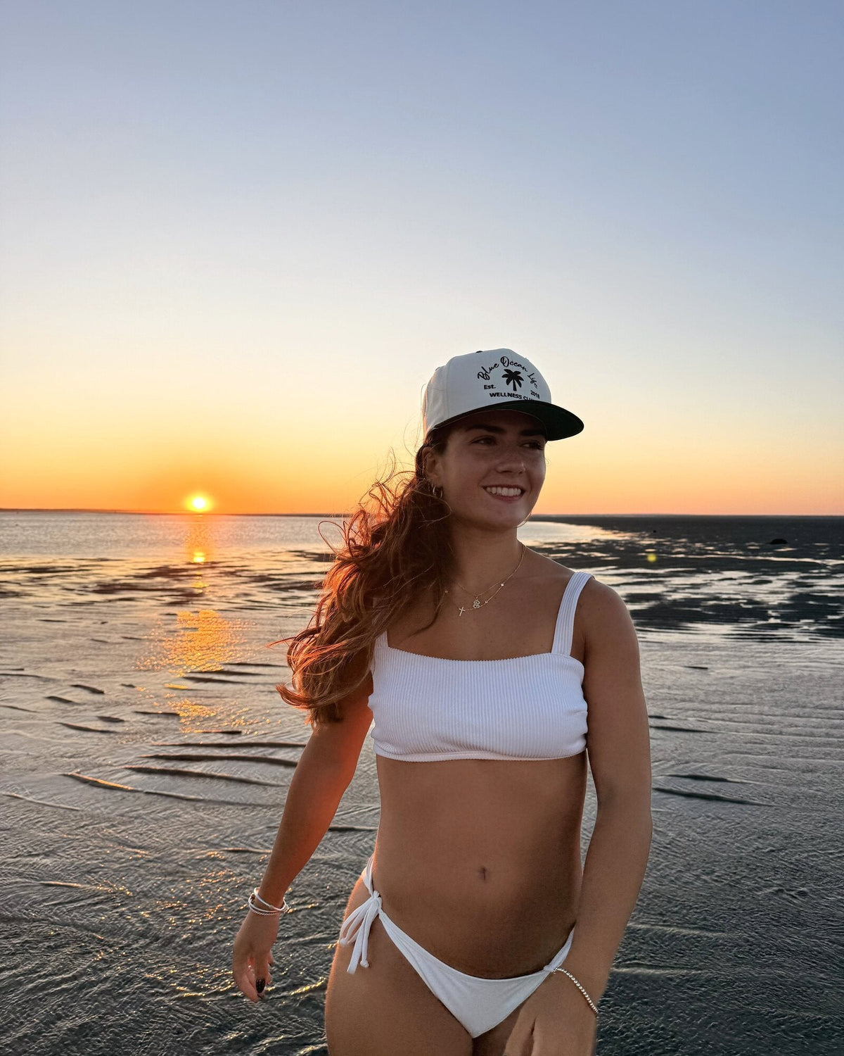Blue Ocean Life Wellness Club Snapback Hat beach lifestyle photo at sunset