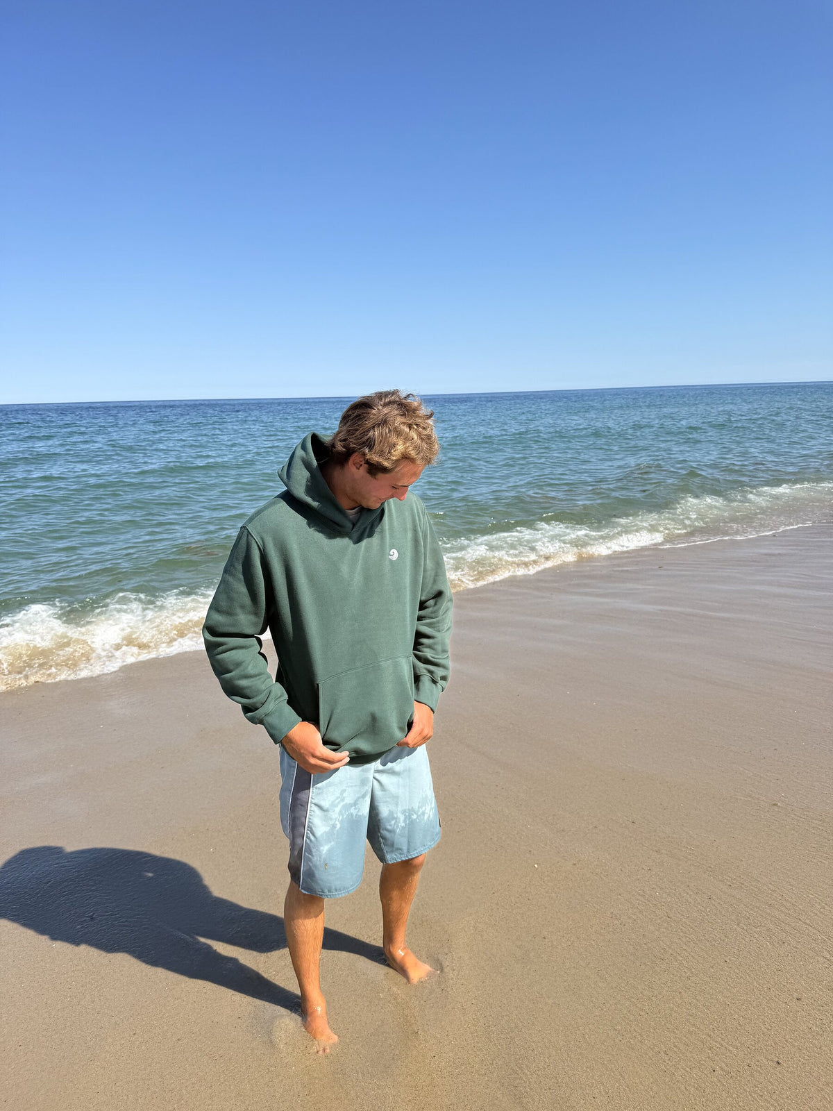 Healing Wave embroidered hoodie in forest green full-body view